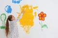 Little child painting wall with roller brush Royalty Free Stock Photo