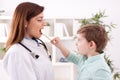 Little child playing with doctor examining Royalty Free Stock Photo