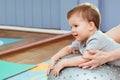 Little baby plays with a fitball in the gym Royalty Free Stock Photo