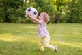 Little child is playing with football ball in park Royalty Free Stock Photo