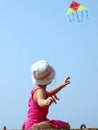 Little child playing with a kite