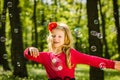 Little child playing with soap bubbles Royalty Free Stock Photo