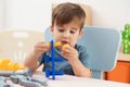 Little child playing with toy construction tools Royalty Free Stock Photo