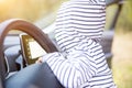 Little child plays at the steering wheel of a modern car. close-up no face. interior of a premium car. young driver concept