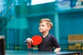 Little child plays table tennis in the gym Royalty Free Stock Photo