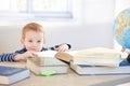 Little child prodigy learning at home smiling Royalty Free Stock Photo