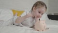 little child put money piggy bank, collect cash coins bank, save money success, wealth financial savings idea, small Royalty Free Stock Photo