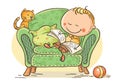 Little child reading a book in an arm-chair with his cat Royalty Free Stock Photo