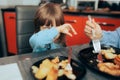 Toddler Girl Refusing to Eat Lunch at Home Royalty Free Stock Photo