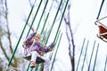 Little child riding on a chaing swing Royalty Free Stock Photo