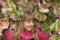 Little child with sakura flowers, spring