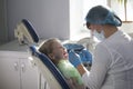 Little child in stomatology chair - children dentistry