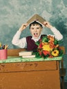 Little child stressed tired leaning on pile of books,