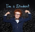 Little child student. Smart redhead kid in suit and glasses on blackboard background with science formulas Royalty Free Stock Photo