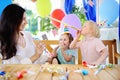 Little child and their mother celebrate birthday party with colorful decoration and cakes with colorful decoration and cake Royalty Free Stock Photo