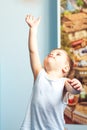 Little child toddler reaching up at home Royalty Free Stock Photo