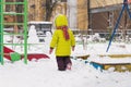 Little child walk on winter playground