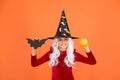 Little child in witch costume. Halloween party. Small girl in black witch hat. Autumn holiday. Join celebration. Magical Royalty Free Stock Photo