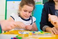 Little children at applique lesson