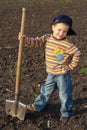 Little children with big shovel Royalty Free Stock Photo