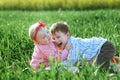 Little children boy and girl play on green grass Royalty Free Stock Photo