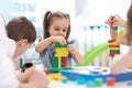 Little kids build block toys at home or daycare. Emotional kids playing with color blocks. Educational toys for Royalty Free Stock Photo