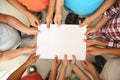 Little children holding sheet of paper in hands together, top view