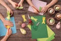 Little children making Easter decorations at table Royalty Free Stock Photo