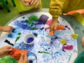 Little children painting, drawing and creating on an art class activity Montessori - learning by doing, education Royalty Free Stock Photo