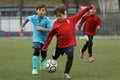 Little children playing football or soccer