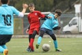 Little children playing football or soccer