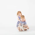 Little Children playing with paper toy airplane sitting on the f Royalty Free Stock Photo