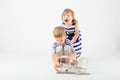 Little Children playing with paper toy airplane sitting on the f Royalty Free Stock Photo