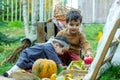 little children are playing in the park with fruits, little girl and boy in the autumn park Royalty Free Stock Photo