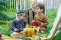 little children are playing in the park with fruits, little girl and boy in the autumn park Royalty Free Stock Photo