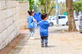 Little children recycling plastic water bottles. World Environment Day.