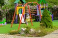 Little children run around and play in the playground. Game cent