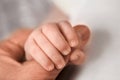 Child holds adult finger close up Royalty Free Stock Photo