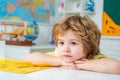 Little children at school lesson. Kid is learning in. Portrait of Pupil of primary school study indoors. School kids. Royalty Free Stock Photo