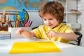 Little children at school lesson. Portrait of Pupil in classroom. Home school for pupil. Home schooling. Back to school.