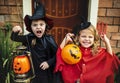 Little children trick or treating on Halloween Royalty Free Stock Photo