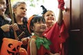 Little children trick or treating on Halloween Royalty Free Stock Photo