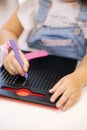 Little children using magnetic pen in kindergarden. Educational games Royalty Free Stock Photo