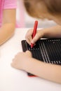 Little children using magnetic pen in kindergarden. Educational games Royalty Free Stock Photo