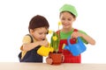 Little children watering for potted narcissus Royalty Free Stock Photo