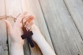 Little childs hands holding wooden rosary Royalty Free Stock Photo