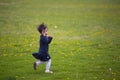 Happy gril running on dandelion field