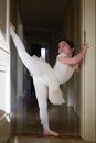 Ballet girl stretching and practising