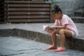 Little chinese girl reading book