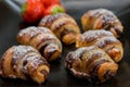 Little chocolat croissants with strawberries